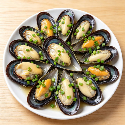 Open mussels on the half shell topped with herb butter