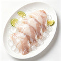 Baby cuttlefish tubes resting on crushed ice with lime